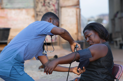 africa humanitarian aid doctor taking care patient to post